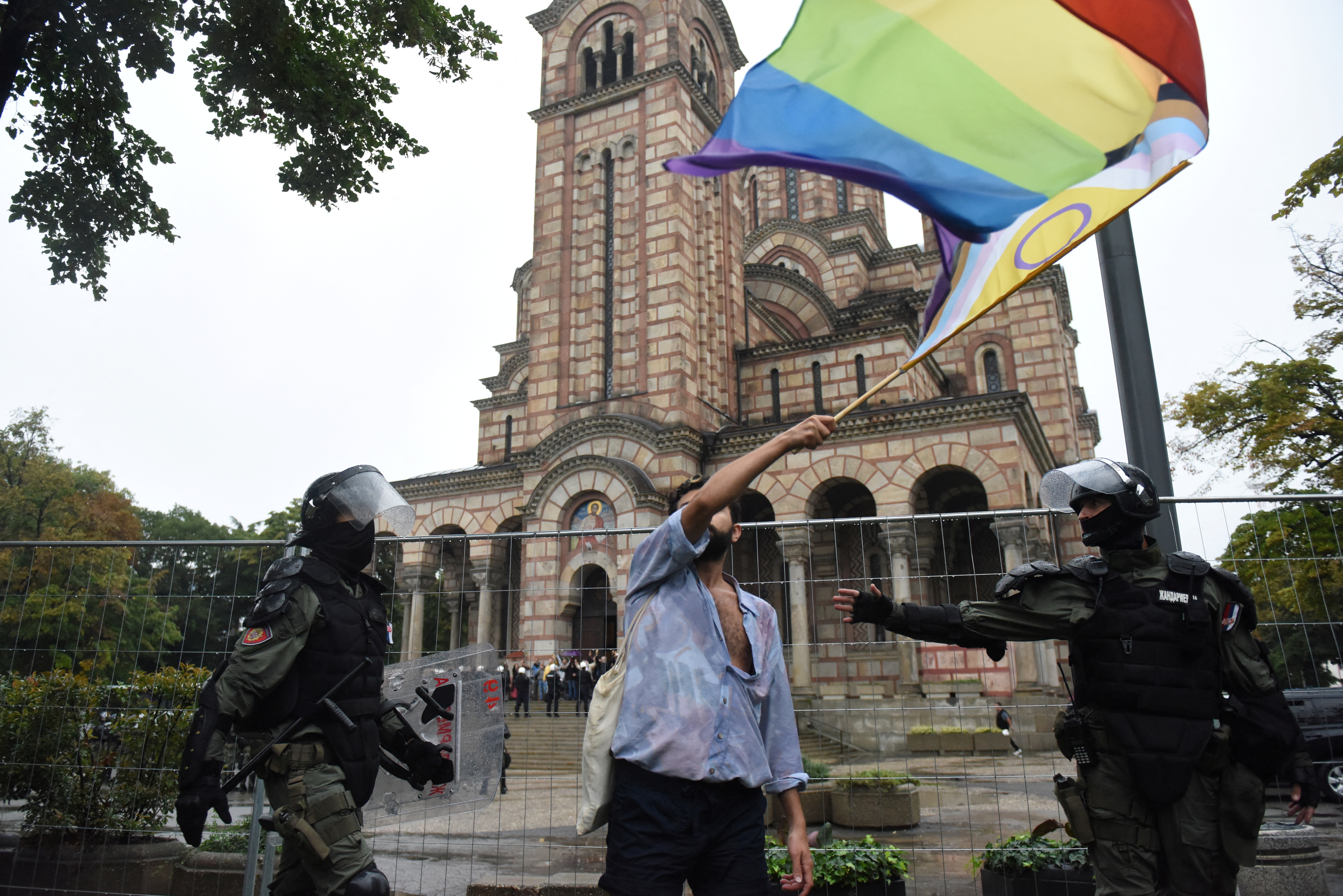 A person waves a flag during the European LGBTQ pride march in Belgrade, Serbia, September 17, 2022. 