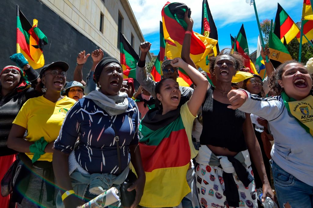 Hundreds of Colombian social leaders and rights defenders from different communities including afro descendants, indigenous, and campesinos take part in a May Day march to denounce violence against human rights defenders in Bogotá on May 1, 2019. Photo: RAUL ARBOLEDA/AFP via Getty Images